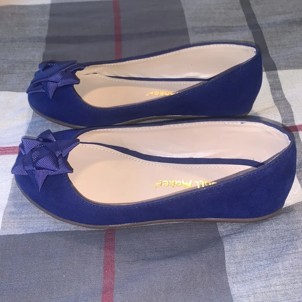 Kids shoes. The doll maker brand.